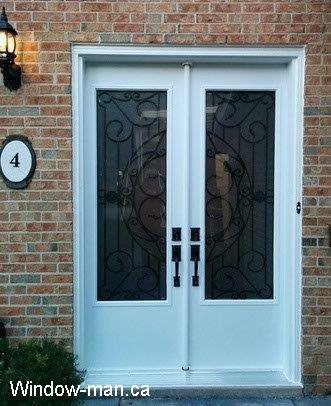 Double Front door. Double front entry steel insulated.  White. 8 foot 96 inches. Three quarters wrought iron glass door inserts. Rochester glass design